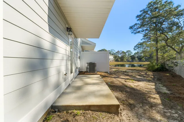 a view of a backyard with pathway