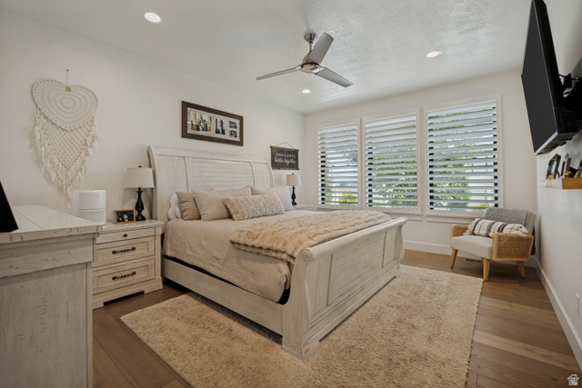 13257 Sky Rnch Road Herriman, UT 84096 - Photo 13 of 17 Recessed lighting, ceiling fan, wood-finish flooring, and white plantation shutters on multiple windows