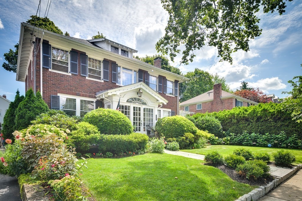 104 Manet Road Newton, MA 02467 - Photo 1 of 24 a front view of a house with a yard
