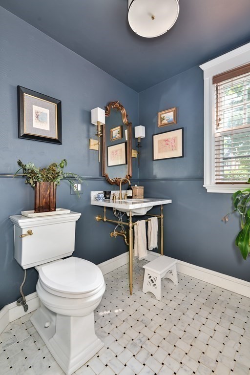 104 Manet Road Newton, MA 02467 - Photo 11 of 24 a bathroom with a toilet a sink and a mirror