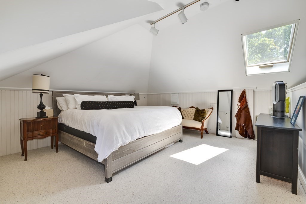 104 Manet Road Newton, MA 02467 - Photo 17 of 24 a bedroom with a bed and book shelf