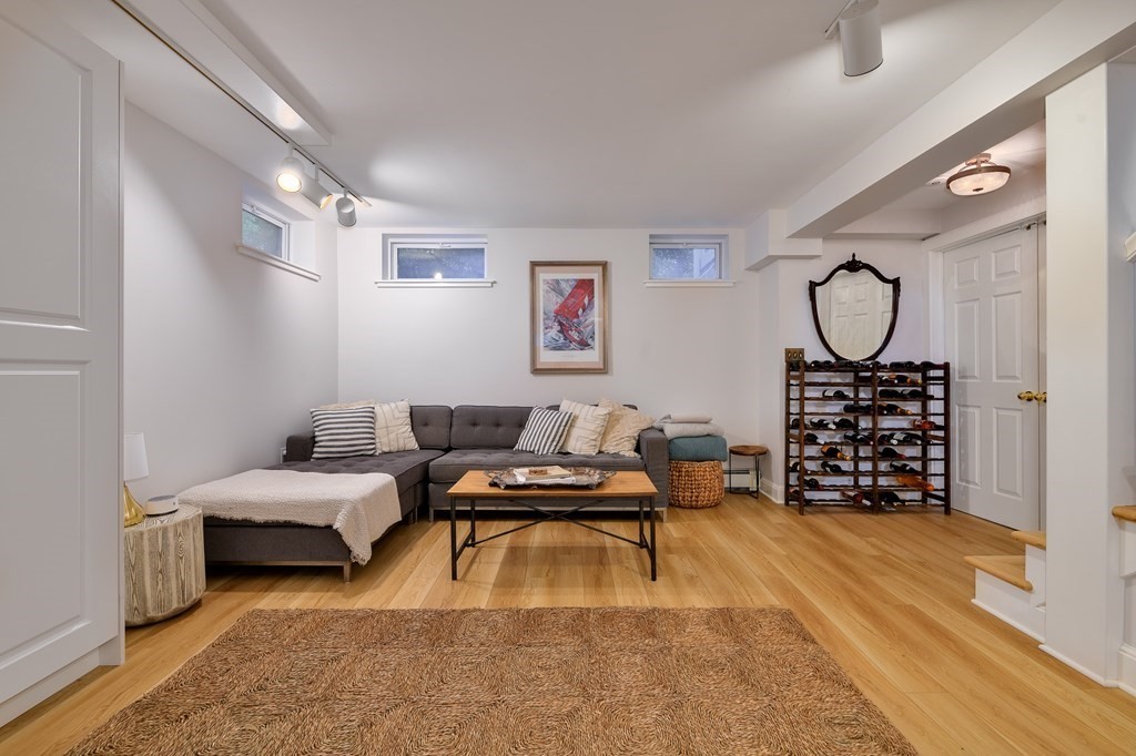 104 Manet Road Newton, MA 02467 - Photo 20 of 24 a bedroom with filled bed and a window