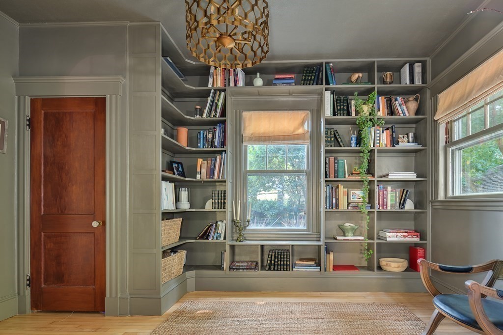 104 Manet Road Newton, MA 02467 - Photo 3 of 24 a living room with furniture a bookshelf and a window