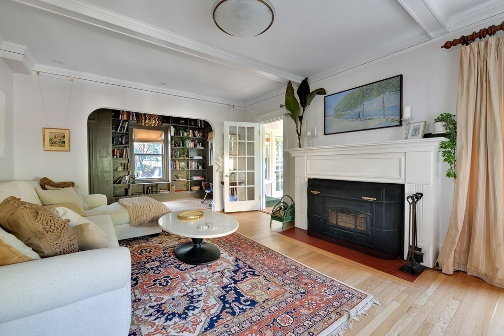 104 Manet Road Newton, MA 02467 - Photo 5 of 24 a living room with furniture and a fireplace