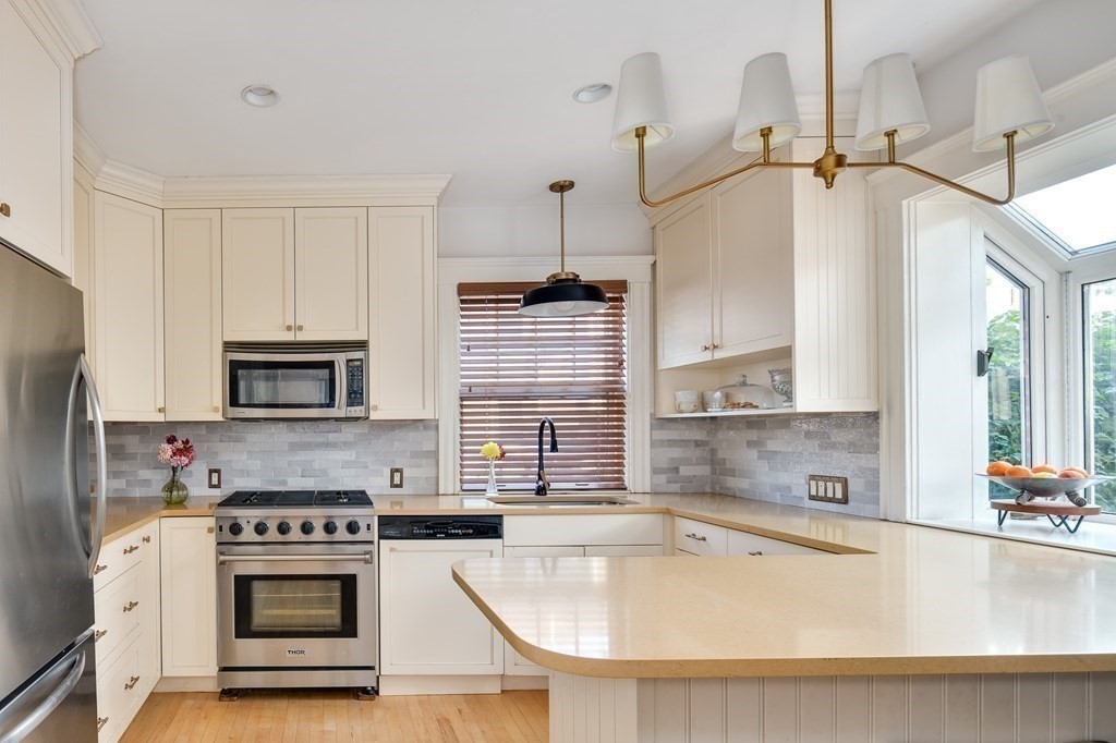 104 Manet Road Newton, MA 02467 - Photo 9 of 24 a kitchen with a stove a sink and a refrigerator