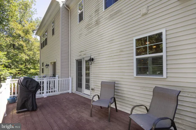 a view of a two chairs in the deck