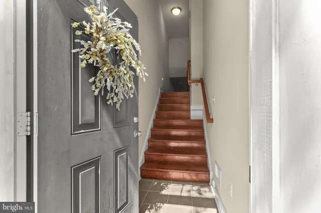 a view of a hallway with stairs