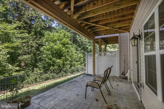 a patio with table and chairs