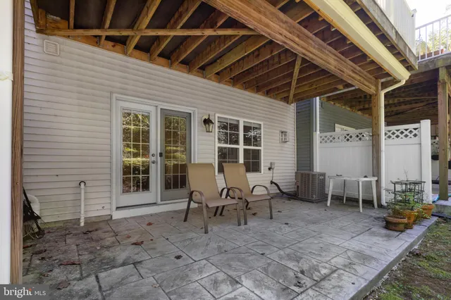 a view of a porch with chairs and floor