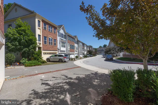 a view of street with parked cars