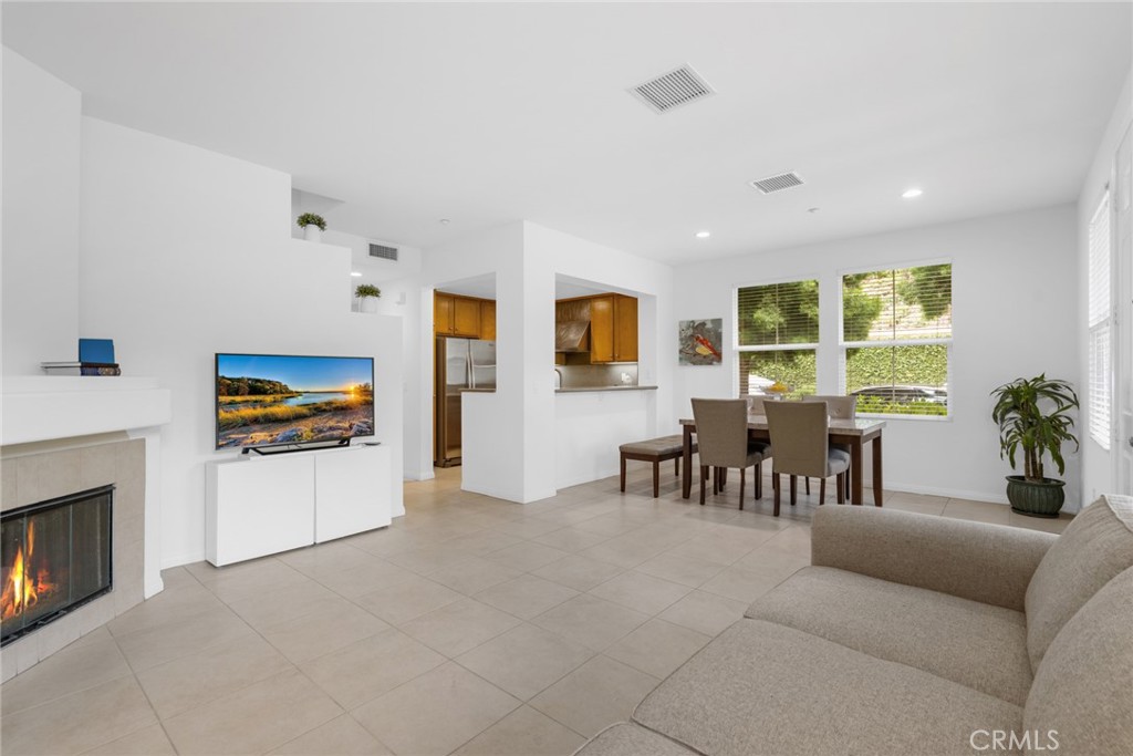 233 Danbrook Irvine, CA 92603 - Photo 14 of 32 a living room with furniture fireplace and window