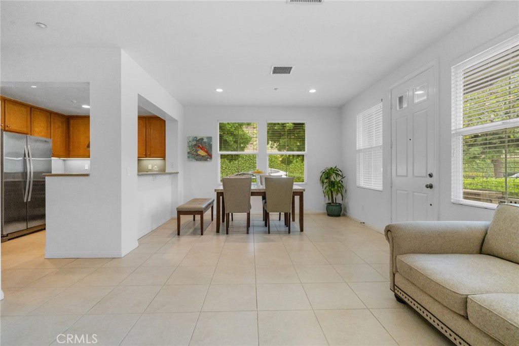 233 Danbrook Irvine, CA 92603 - Photo 15 of 32 a living room with furniture and a large window