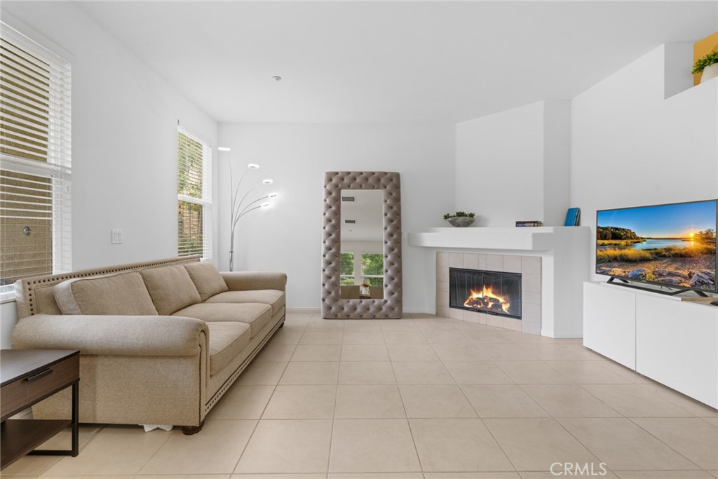 233 Danbrook Irvine, CA 92603 - Photo 16 of 32 a living room with furniture and a fireplace