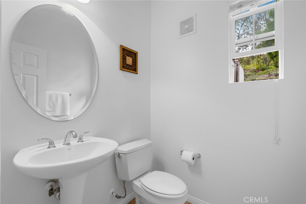 233 Danbrook Irvine, CA 92603 - Photo 19 of 32 a bathroom with a sink mirror and toilet