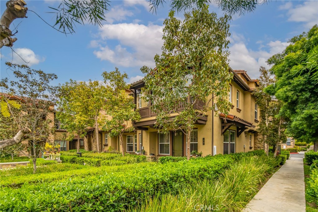 233 Danbrook Irvine, CA 92603 - Photo 2 of 32 a view of a building with a garden