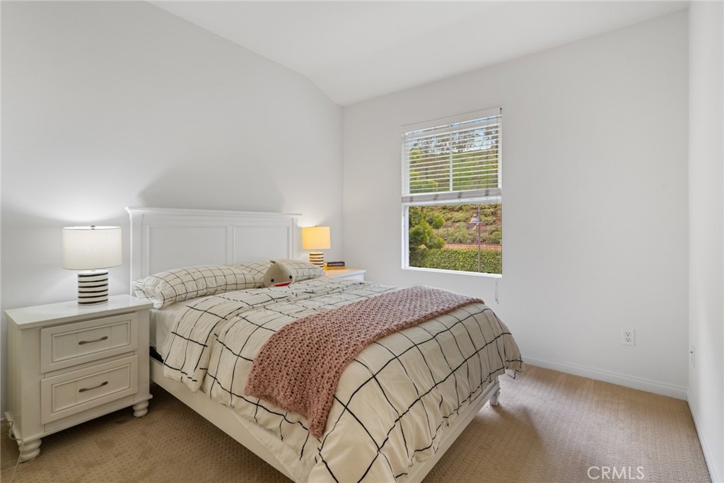 233 Danbrook Irvine, CA 92603 - Photo 24 of 32 a bedroom with a bed and a window
