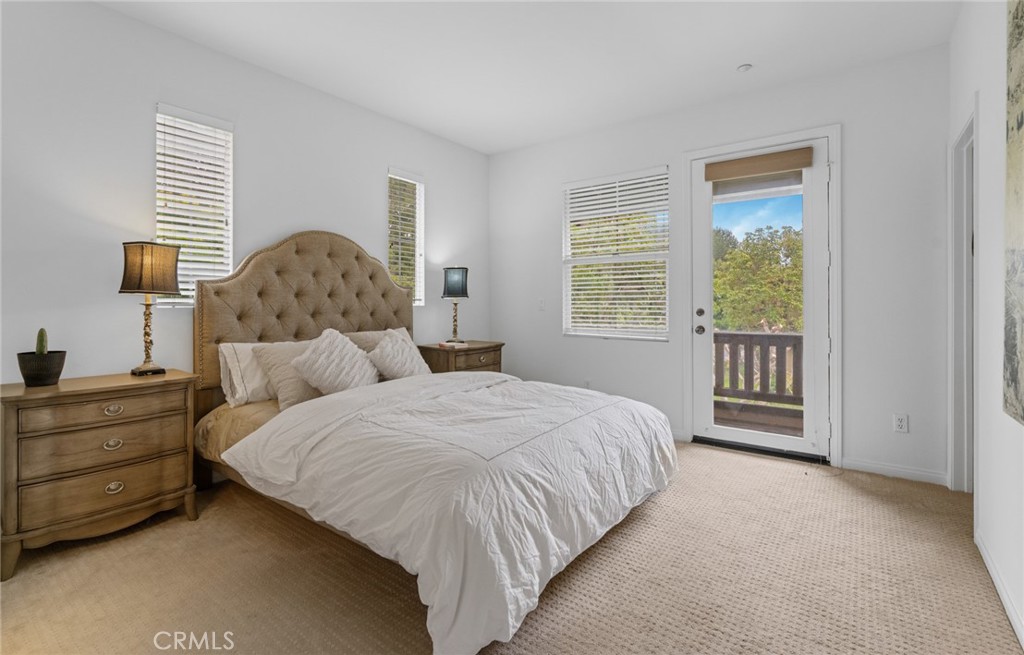 233 Danbrook Irvine, CA 92603 - Photo 28 of 32 a bedroom with a bed and a window