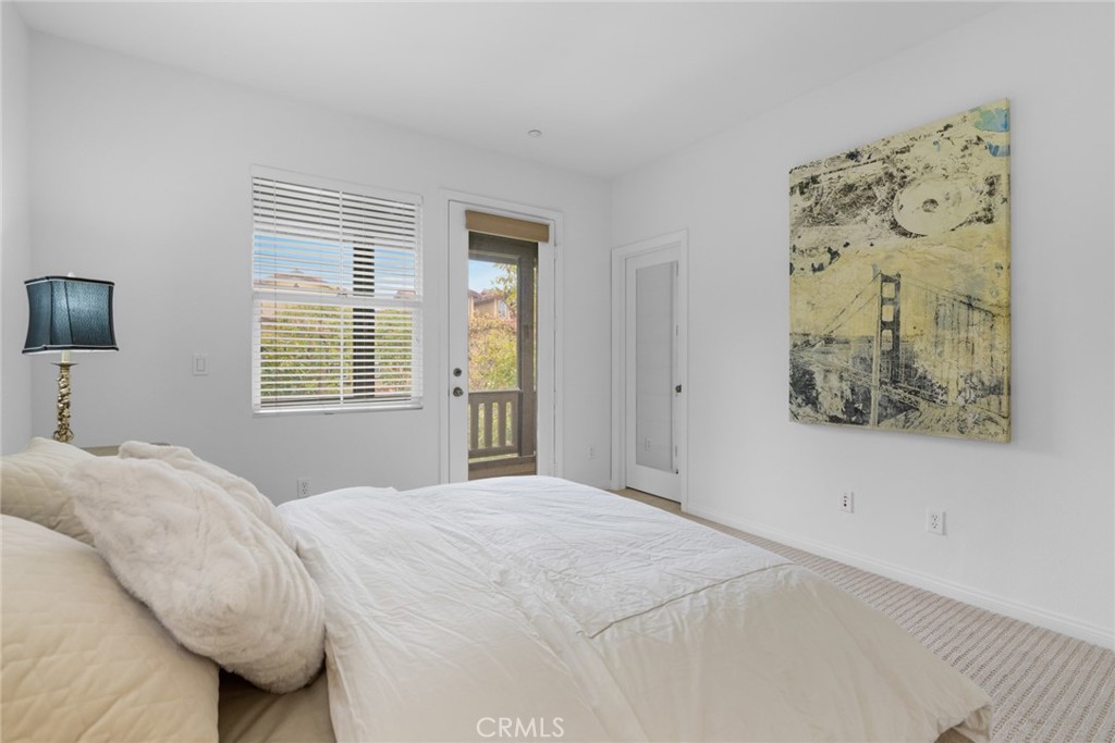 233 Danbrook Irvine, CA 92603 - Photo 29 of 32 a bedroom with a bed and a window