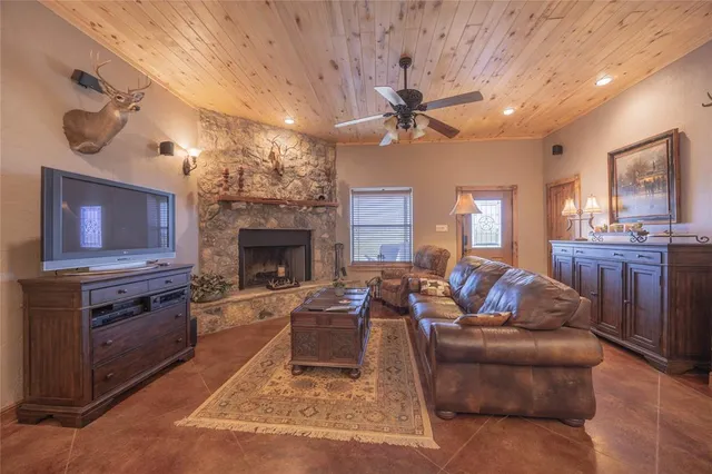 a kitchen with stainless steel appliances granite countertop sink stove refrigerator and cabinets