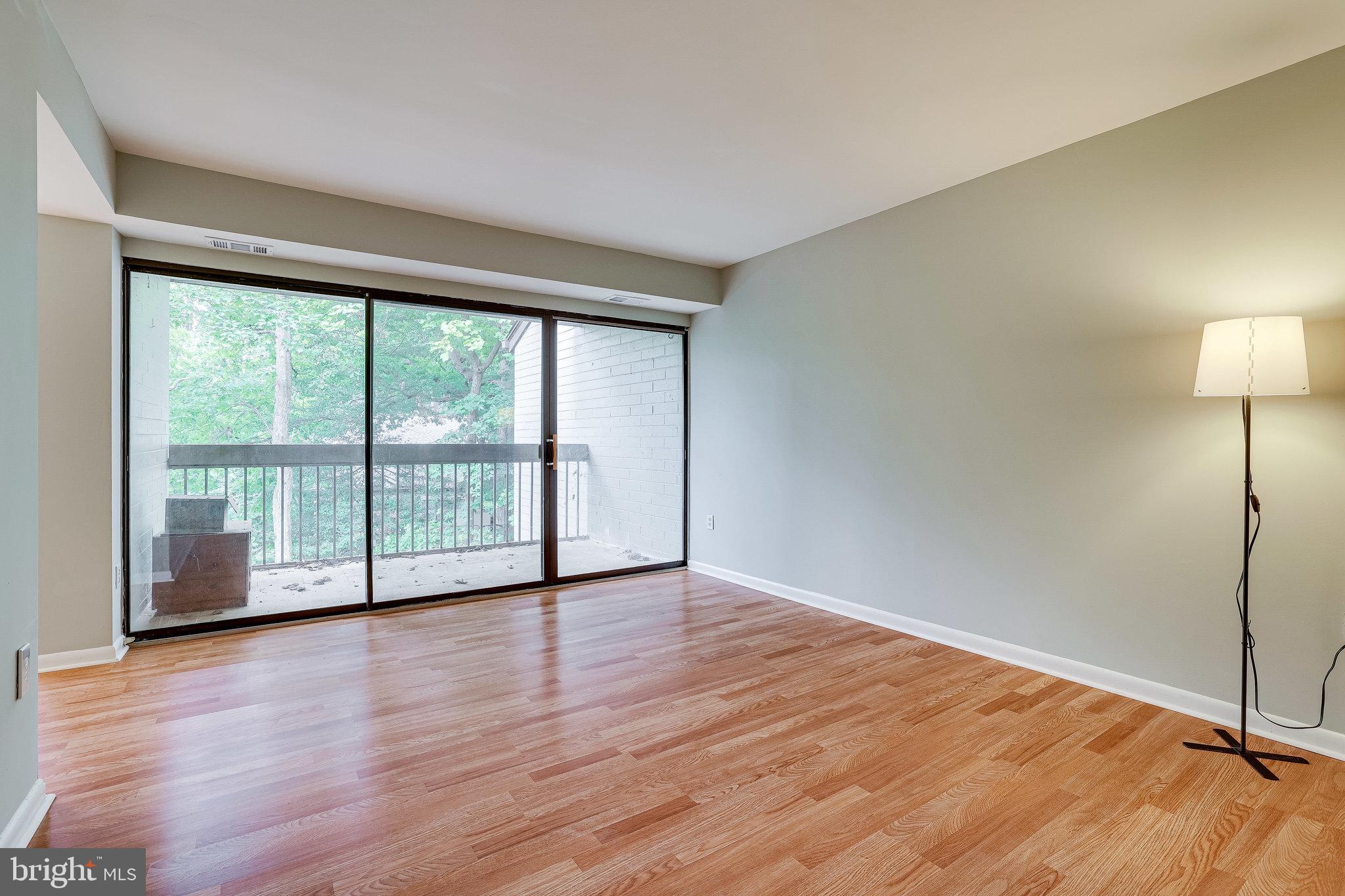 2210 Springwood Drive, Unit 207 Reston, VA 20191 - Photo 9 of 28 Living Room with Balcony