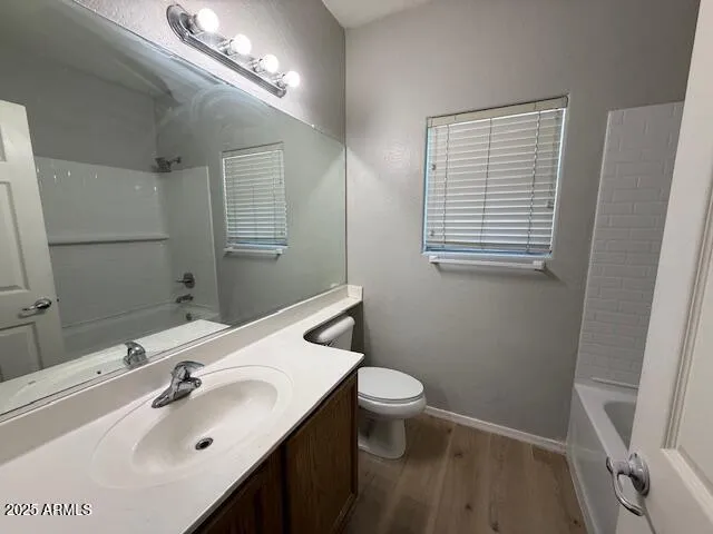 a bathroom with a sink toilet and vanity