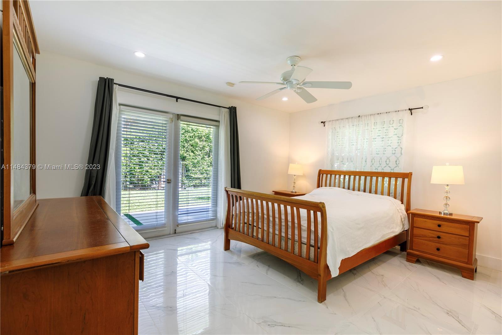 1990 Keystone Boulevard North Miami, FL 33181 - Photo 14 of 20 a bed room with a bed and a window