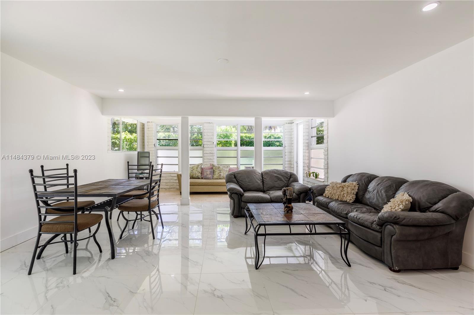 1990 Keystone Boulevard North Miami, FL 33181 - Photo 4 of 20 a living room with furniture and a large window