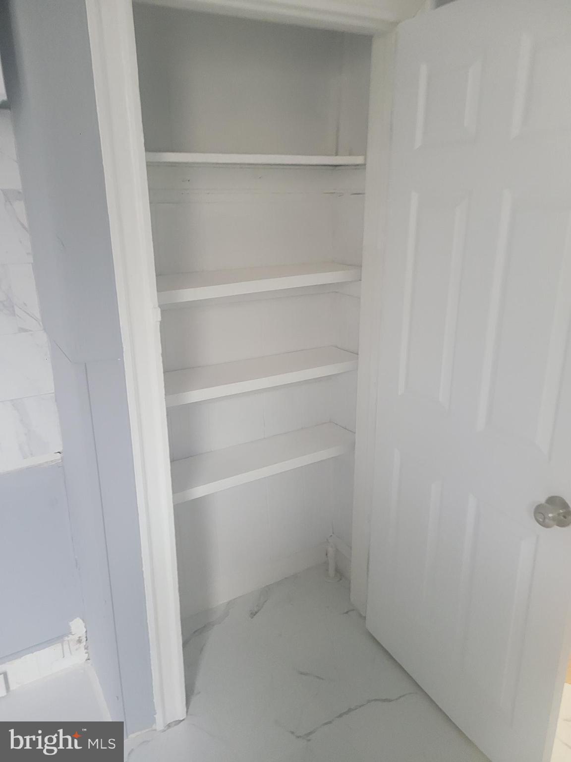 134 North Ruby Street, Unit 2 Philadelphia, PA 19139 - Photo 12 of 16 a view of walk in closet with empty racks