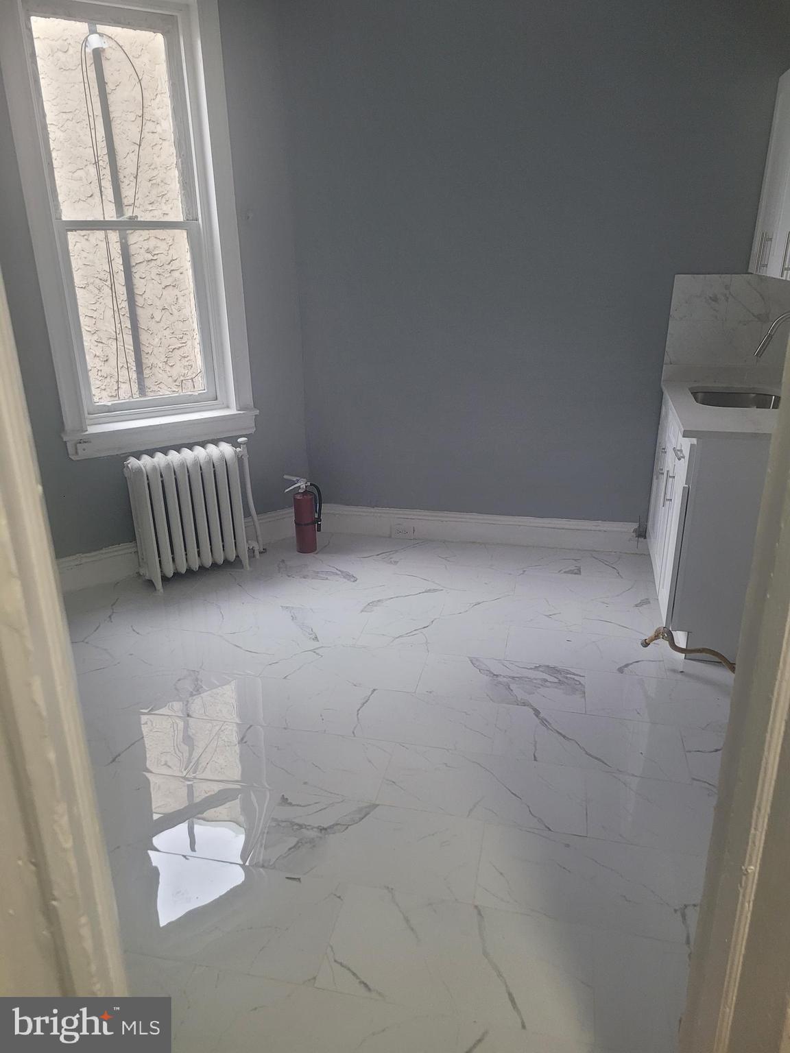 134 North Ruby Street, Unit 2 Philadelphia, PA 19139 - Photo 13 of 16 an empty room with windows