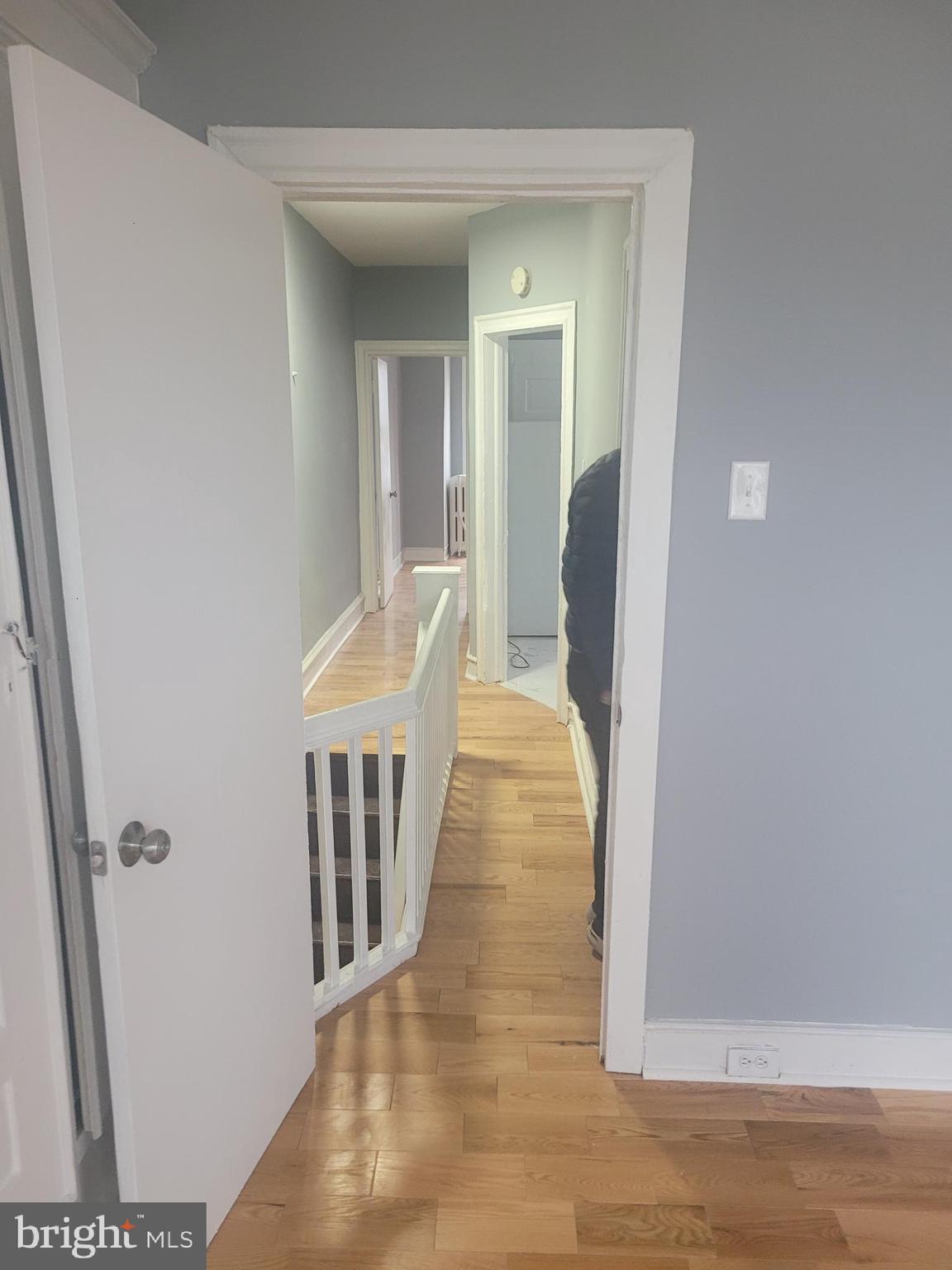 134 North Ruby Street, Unit 2 Philadelphia, PA 19139 - Photo 6 of 16 a hallway with wooden floor and stairs