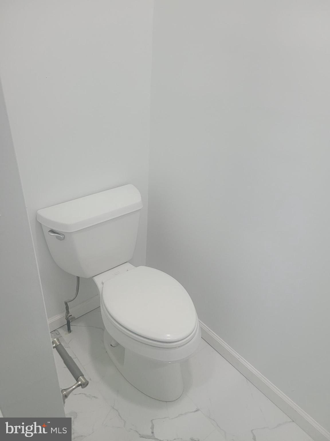 134 North Ruby Street, Unit 2 Philadelphia, PA 19139 - Photo 7 of 16 a white toilet sitting next to a white wall