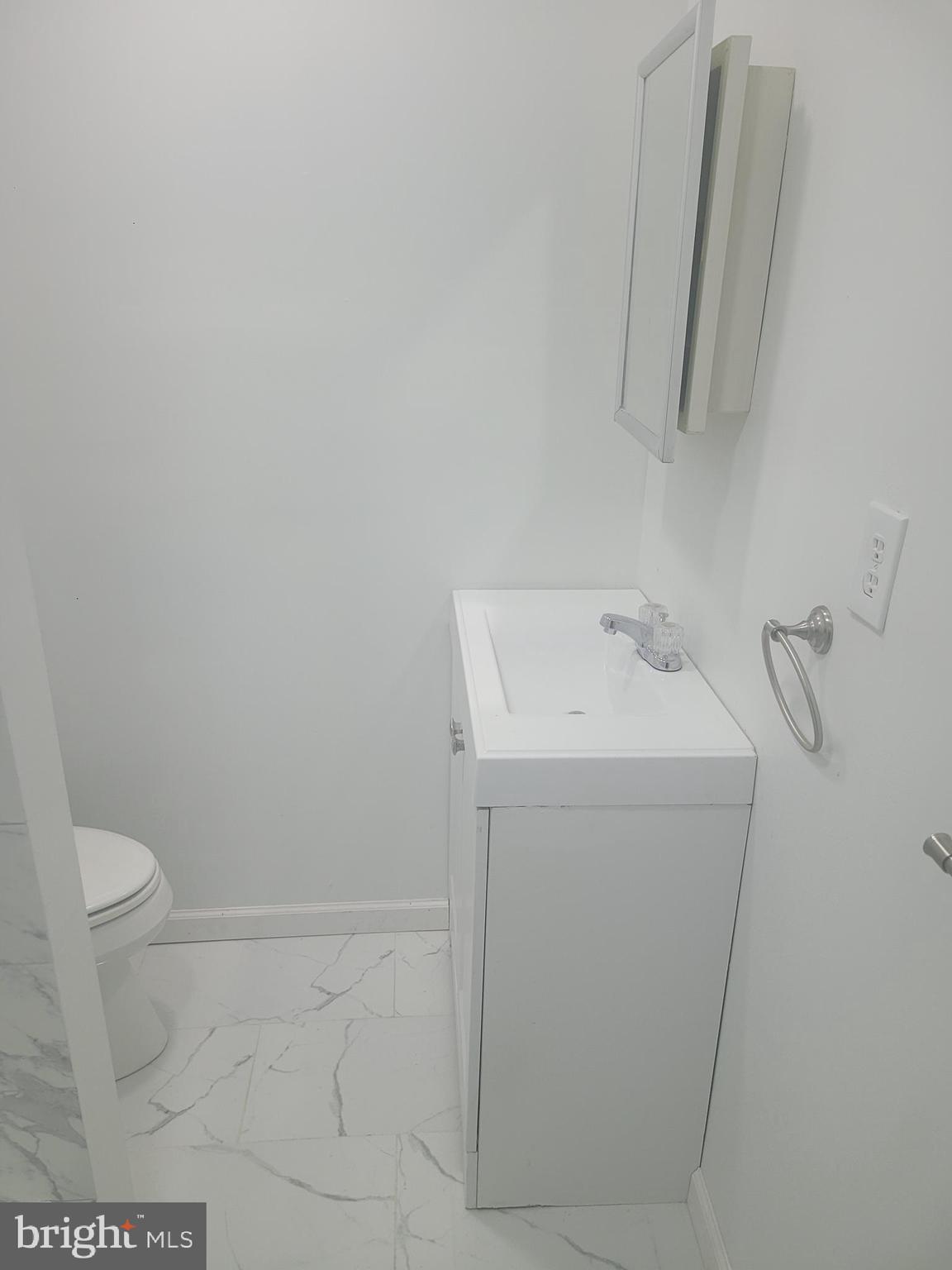 134 North Ruby Street, Unit 2 Philadelphia, PA 19139 - Photo 8 of 16 a bathroom with a sink and toilet