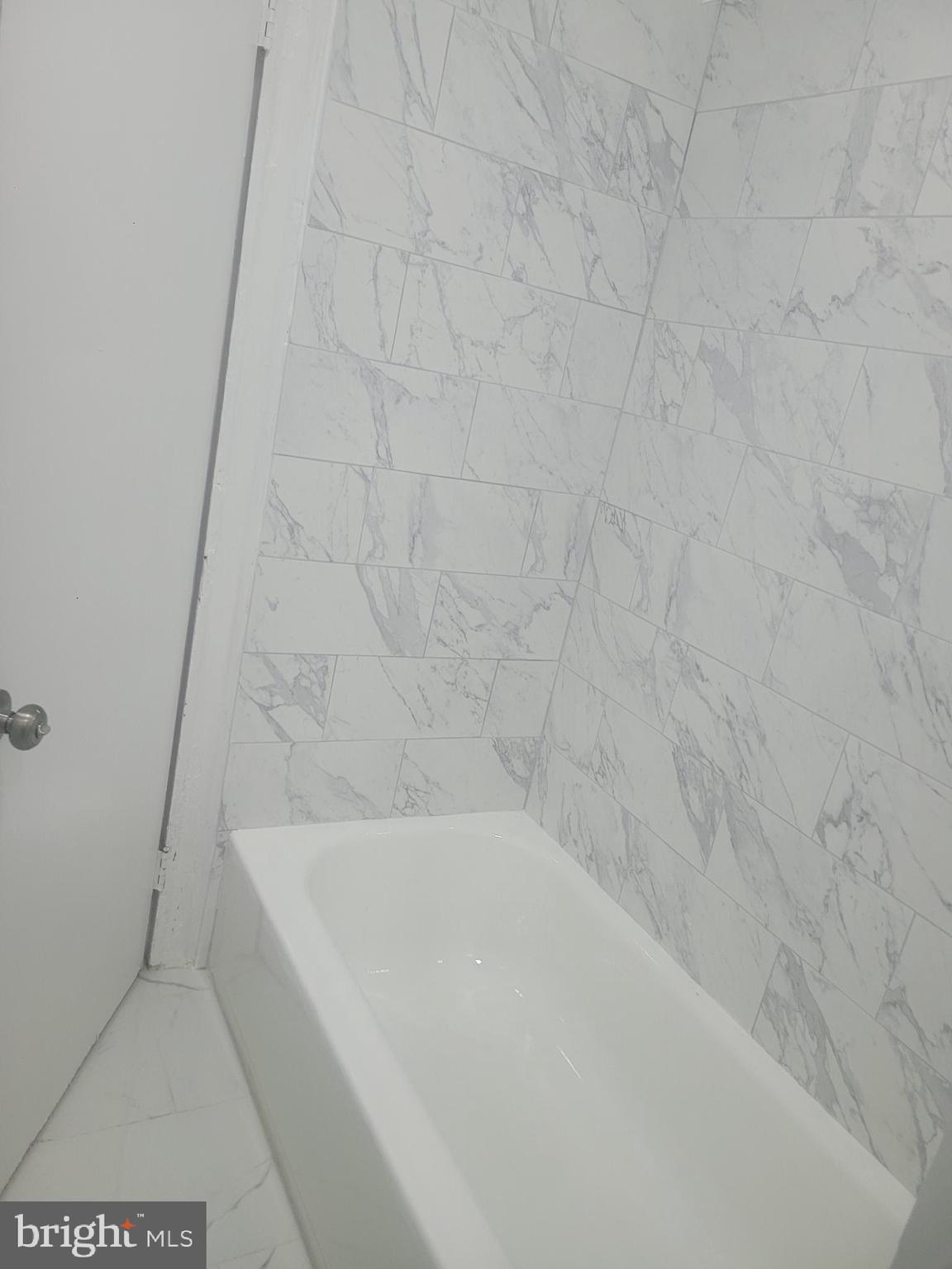 134 North Ruby Street, Unit 2 Philadelphia, PA 19139 - Photo 9 of 16 a bathroom with a bathtub