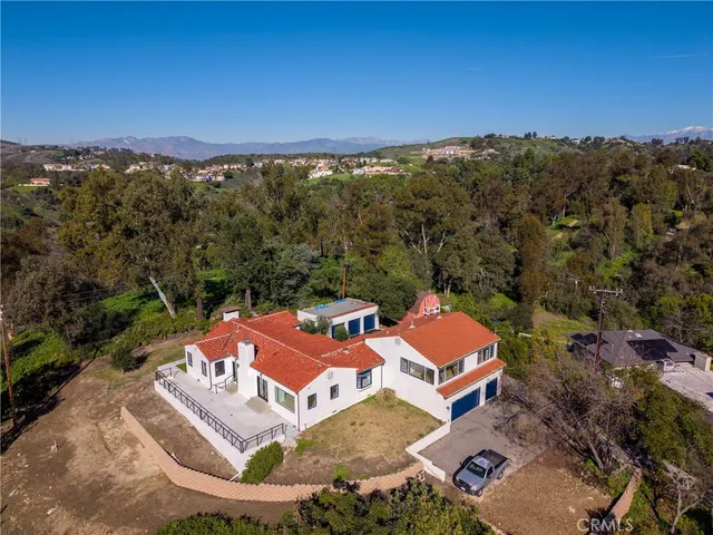 an aerial view of a house with a garden