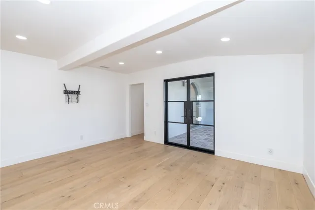 a view of kitchen with kitchen island and stainless steel appliances