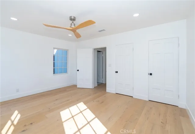 a bath tub sitting in a bathroom next to a window