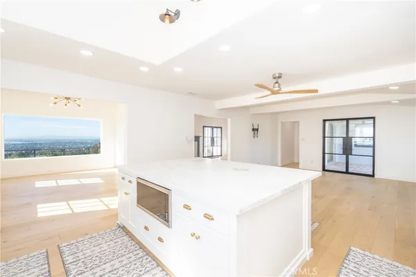 a kitchen with a stove a sink and a refrigerator