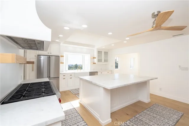 a kitchen with a stove and a refrigerator