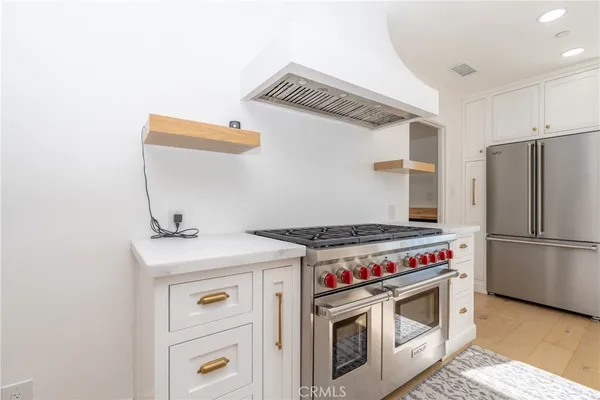 a kitchen with a stove and a sink