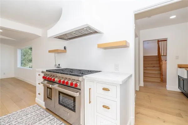 a kitchen with stainless steel appliances a refrigerator and a sink