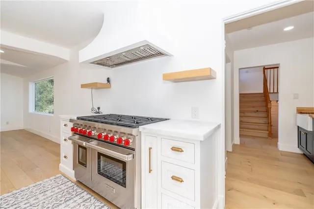 a kitchen with stainless steel appliances a refrigerator and a sink