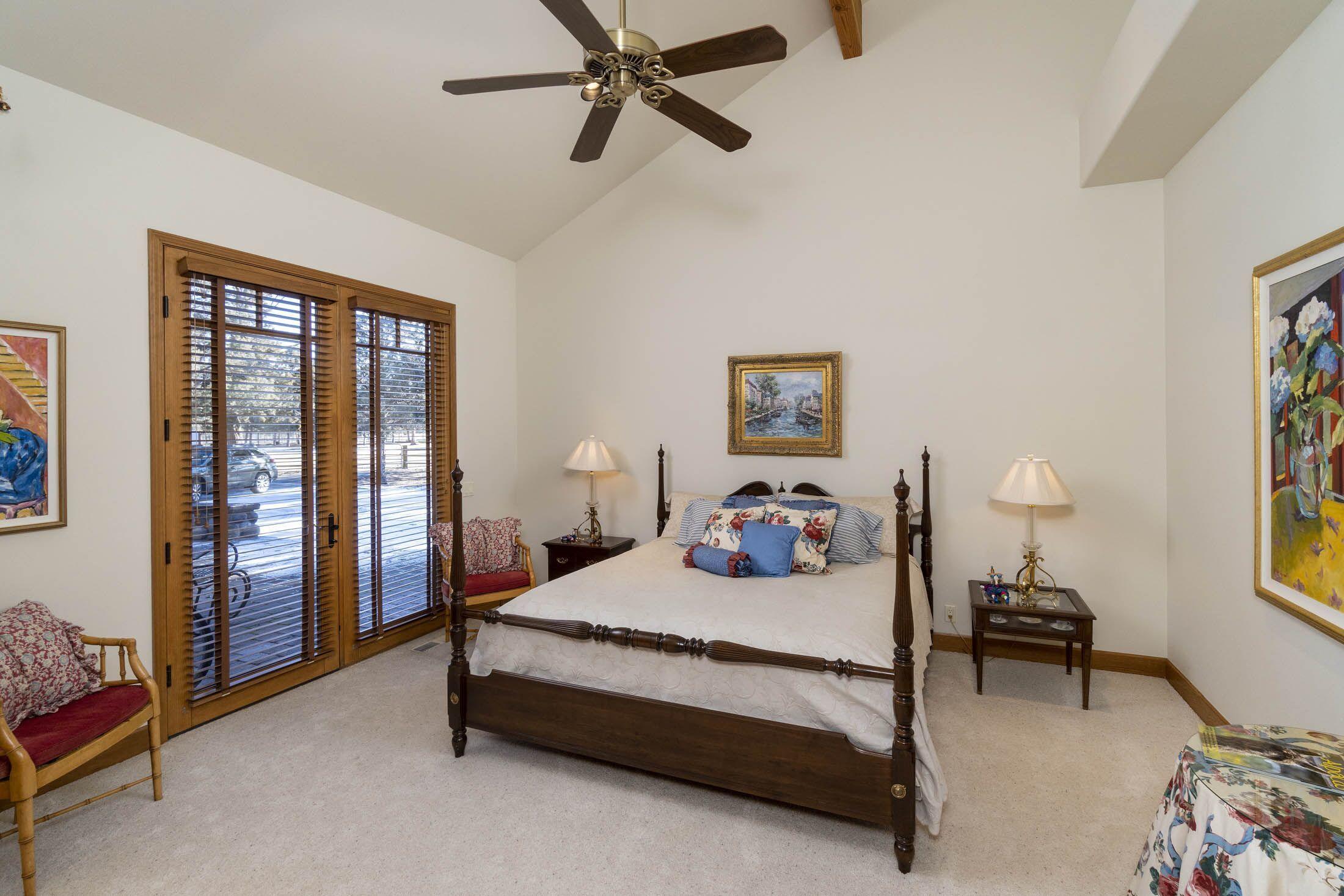 65520 Gerking Market Road Bend, OR 97703 - Photo 16 of 49 Guest Suite with private patio access. Wooden blinds on all ground level rooms.