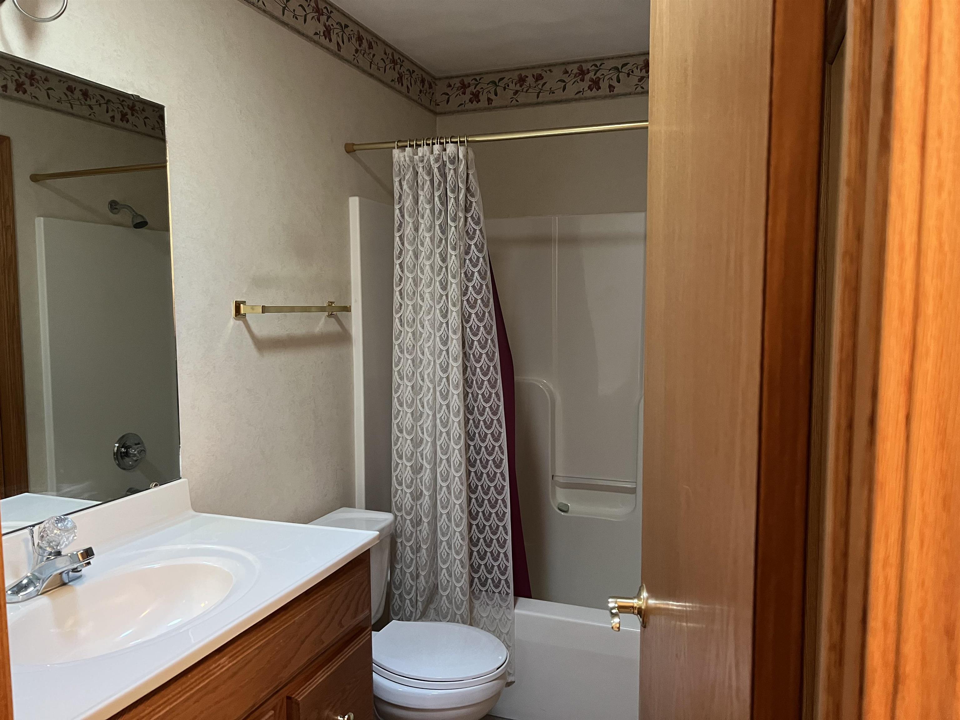 1917 Comanche Court Freeport, IL 61032 - Photo 12 of 25 a bathroom with a sink a toilet and shower