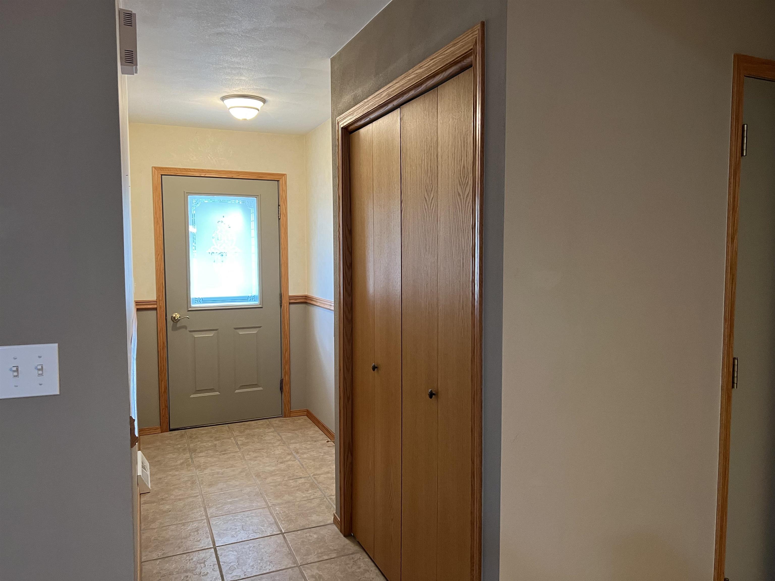 1917 Comanche Court Freeport, IL 61032 - Photo 4 of 25 a view of a hallway with closet and a bathroom
