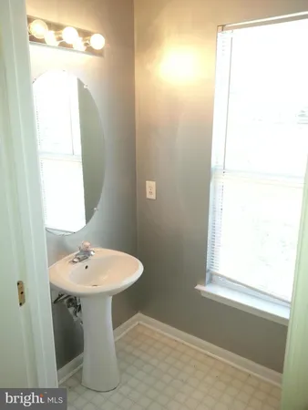 a bathroom with a sink a toilet and bathtub
