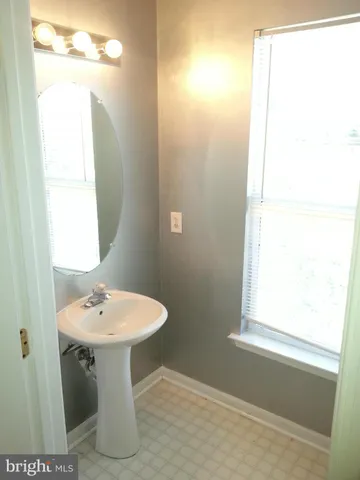 a bathroom with a sink a toilet and bathtub