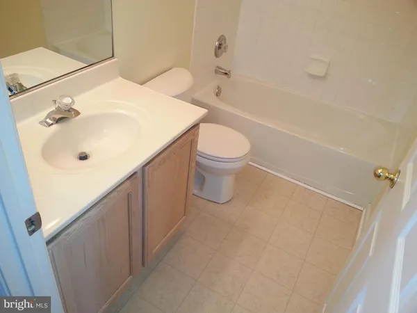 a bathroom with a shower and a bath tub