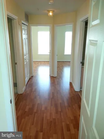a view of a balcony with wooden floor