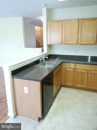 a bathroom with a sink a mirror and a toilet