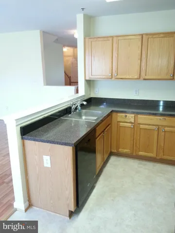a bathroom with a sink a mirror and a toilet